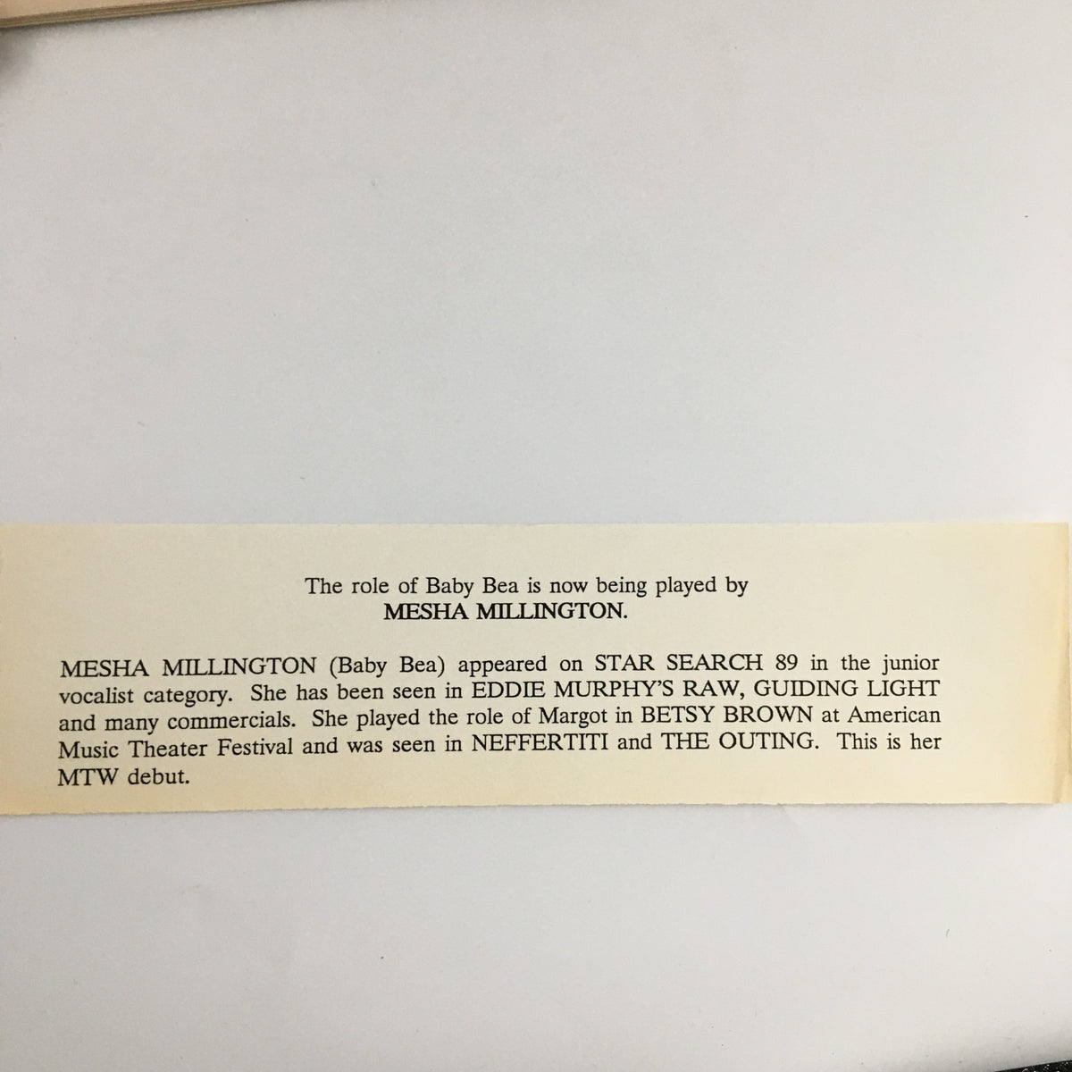 Informational paper from the 1990 Playbill for 'Sugar Hill', featuring a description of the role of Baby Bea, played by Mesha Millington, and her background in performing arts. A collectible piece of musical theatre history.