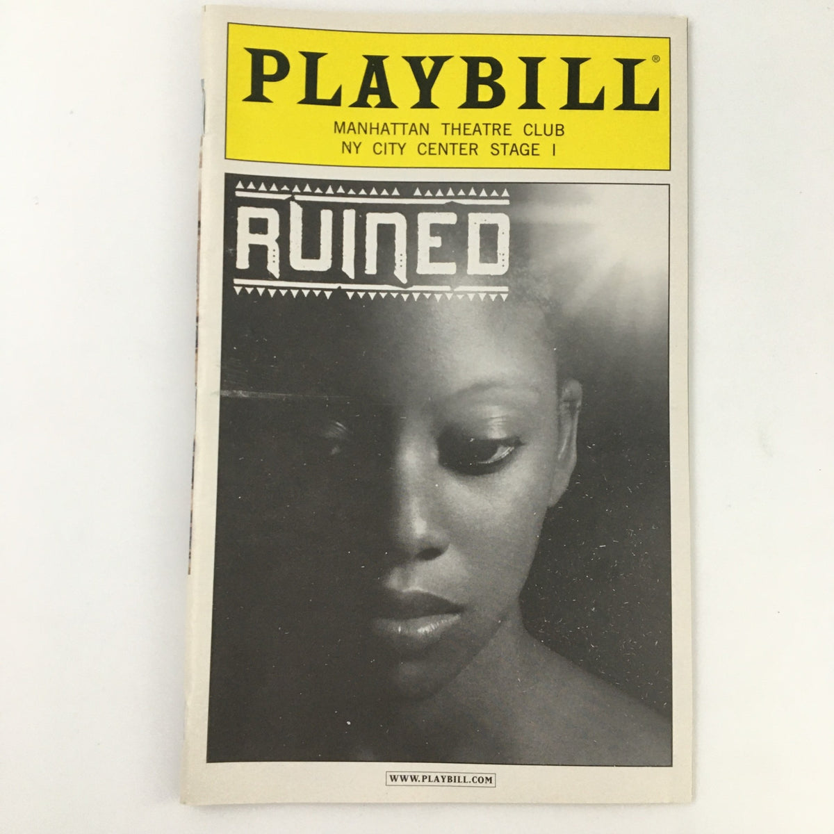 2009 Playbill for 'Ruined' at the Manhattan Theatre Club featuring an artistic black and white cover showcasing a woman's portrait.
