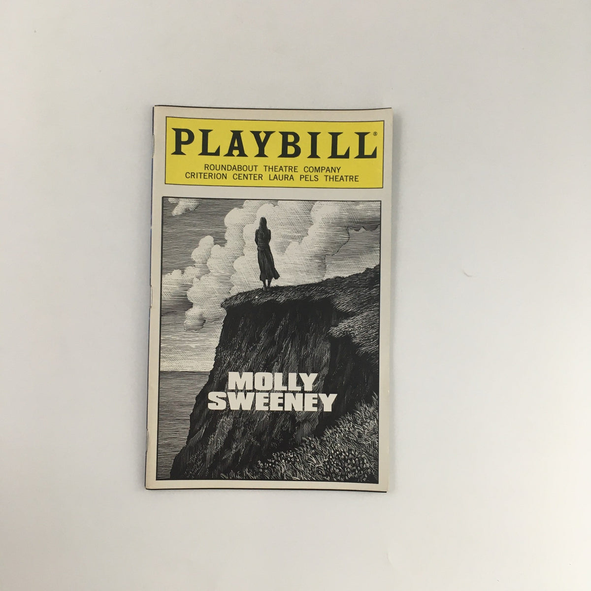 1996 Playbill titled 'Molly Sweeney' from Laura Pels Theatre, showcasing a dramatic cover illustration of a figure on a cliff.