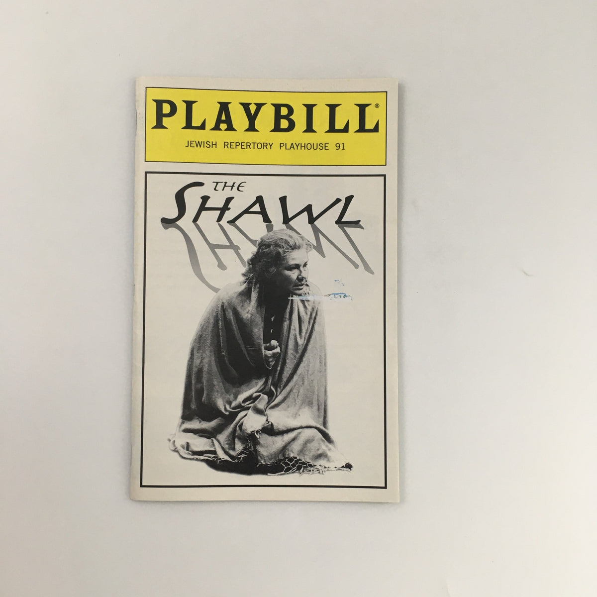 1996 Playbill for 'The Shawl' at Playhouse 91 featuring a dramatic cover with a central character in a shawl.