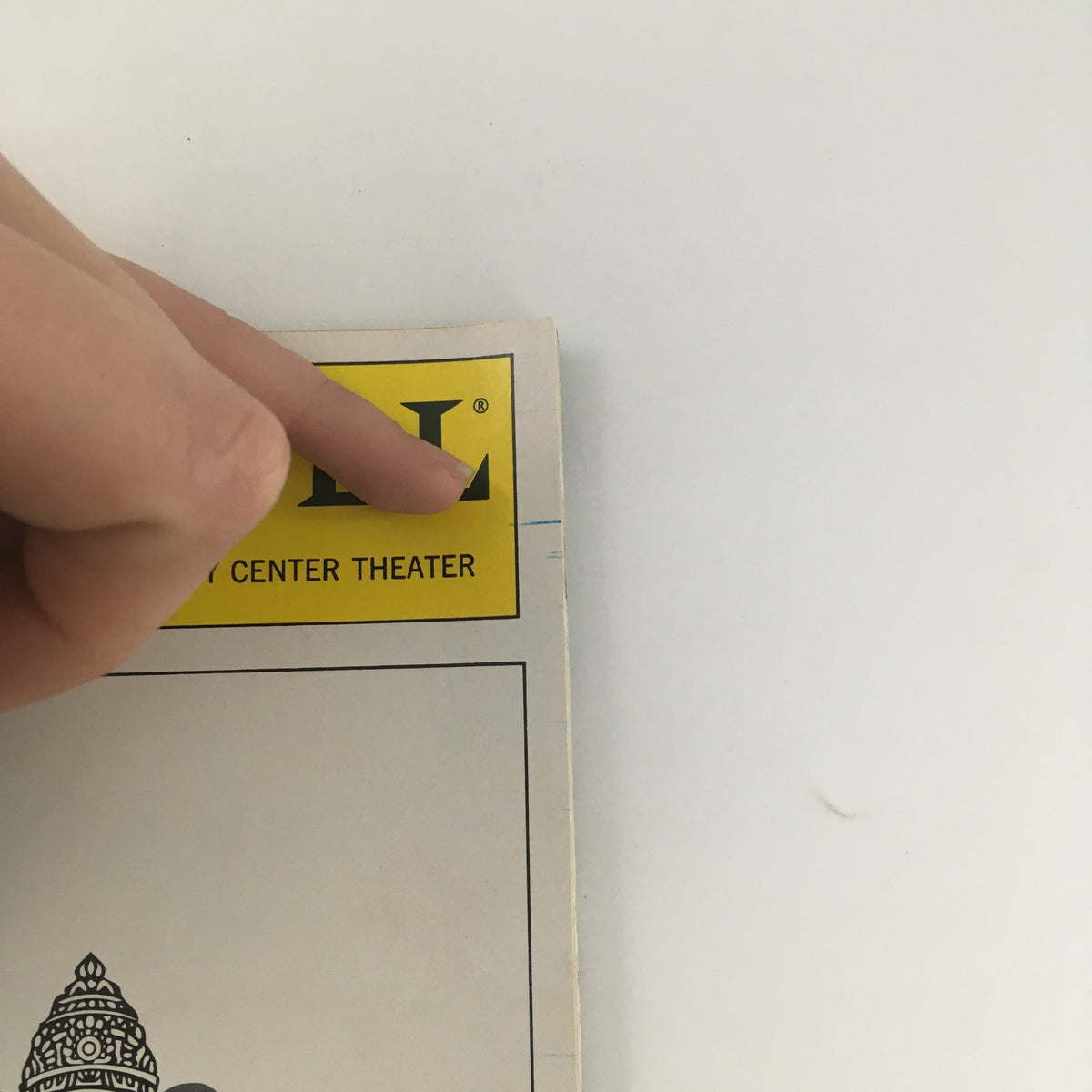 Close-up of the top corner of the 1993 Playbill for 'A Perfect Ganesh,' highlighting the Manhattan Theatre Club logo and year.