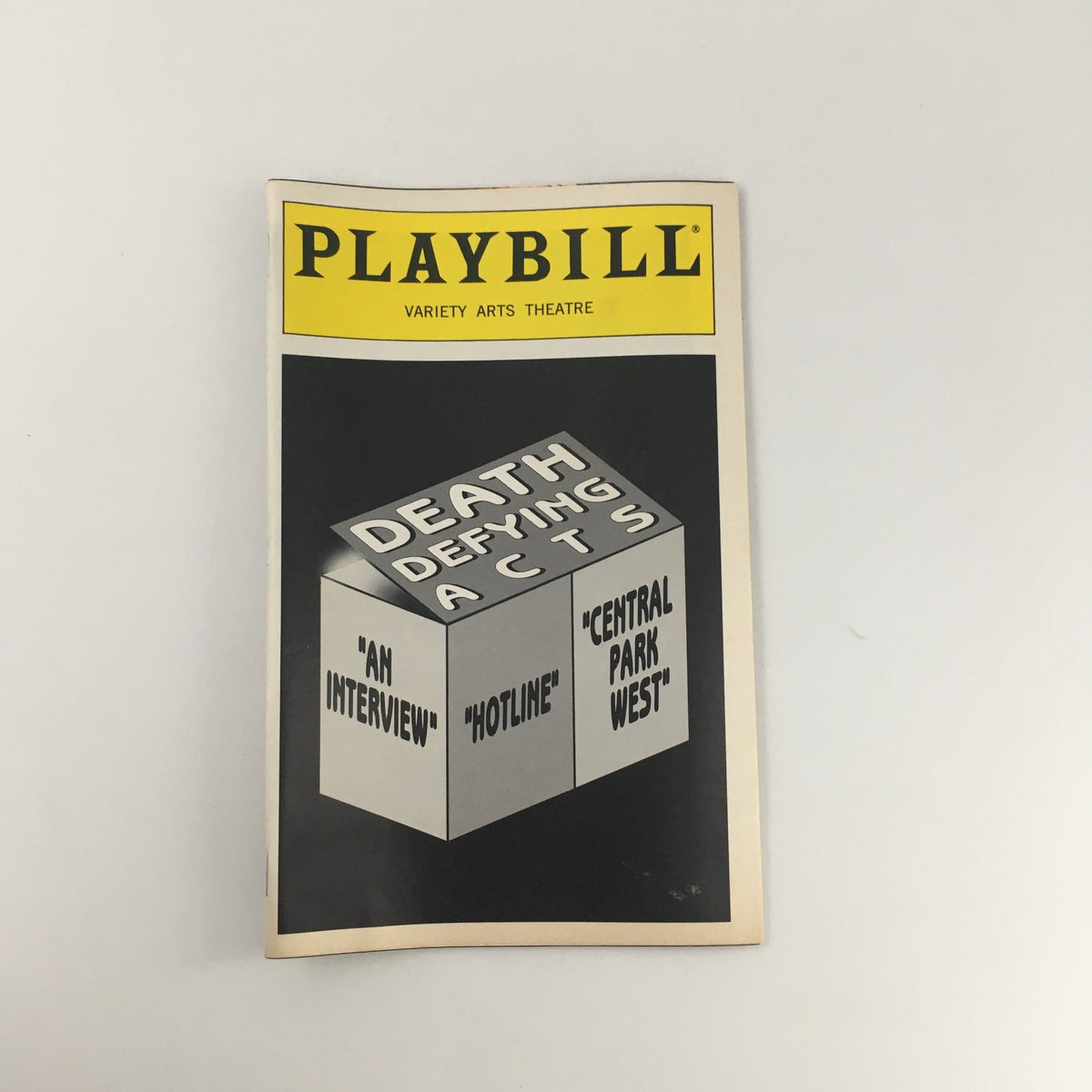 1995 Playbill Variety Arts Theatre 'Death Defying Acts' cover featuring a graphic box design displaying the play's title.