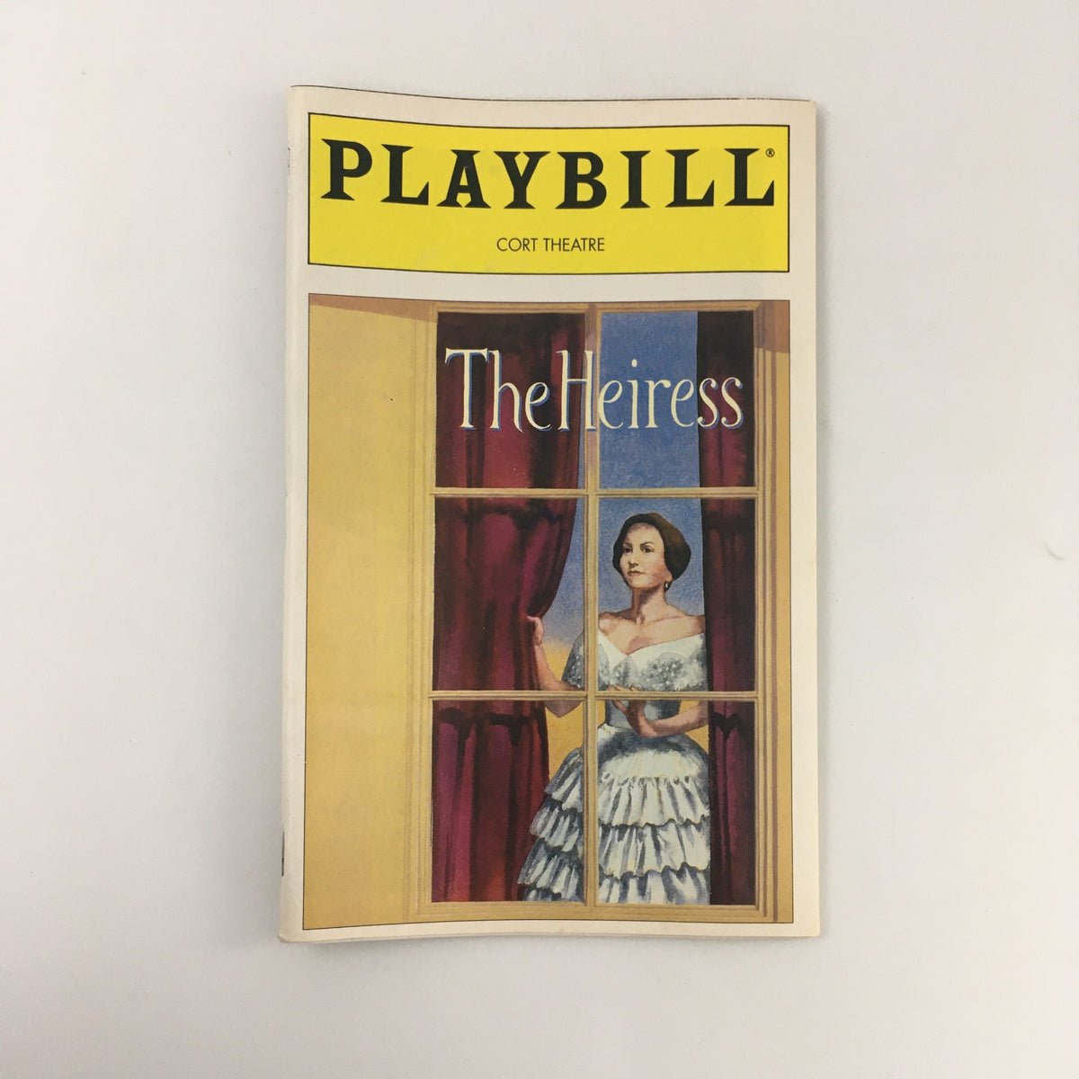 1995 Playbill for 'The Heiress' at the Cort Theatre, featuring a woman in a gown looking out a window, capturing the essence of the iconic production.
