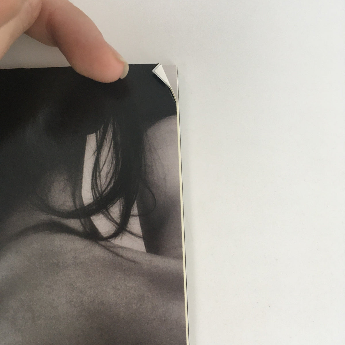 Close-up of the bent corner of the 2009 McCarter Theatre Center 'Mrs. Warren's Profession' cover, showing minor wear.