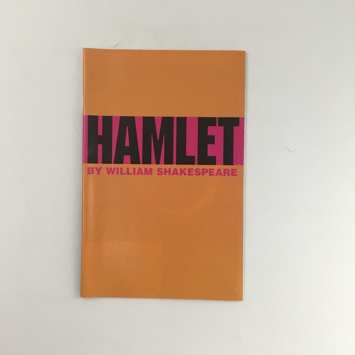 Cover of 'Hamlet' by William Shakespeare, 2005 McCarter Theatre Center edition, featuring a bold orange background and large pink text.