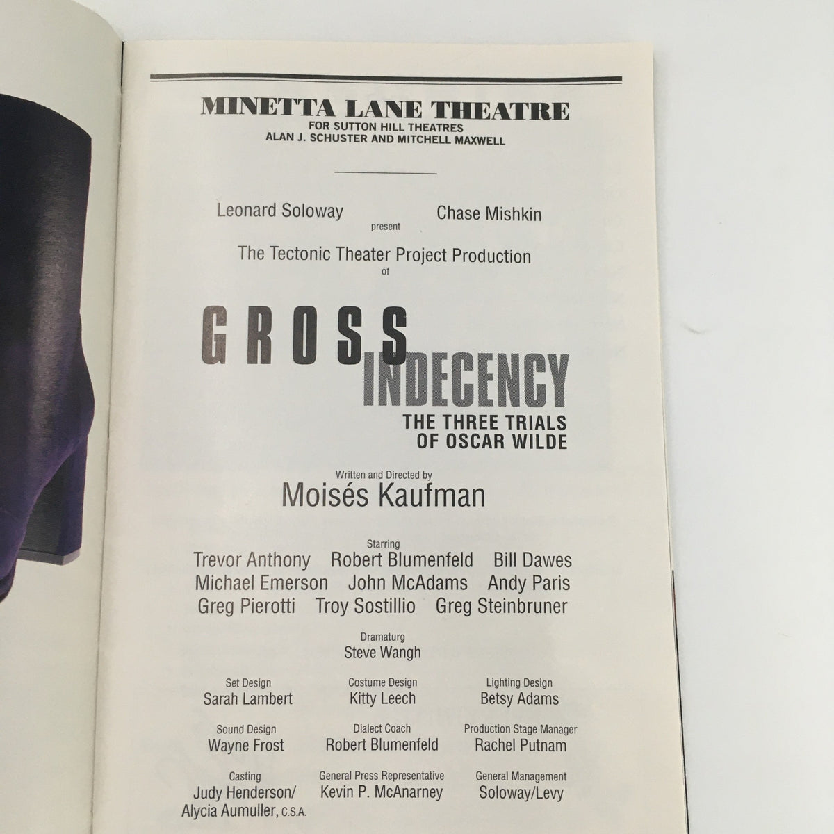 Featured page of the 1997 Playbill for 'Gross Indecency,' highlighting the production details, including director Moisés Kaufman and the cast information.