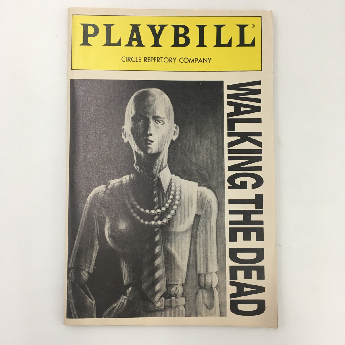 Cover of the 1991 Playbill for the Circle Repertory Company's production of 'Walking The Dead', featuring a stylized illustration of a mannequin-like figure wearing pearls and a striped tie.