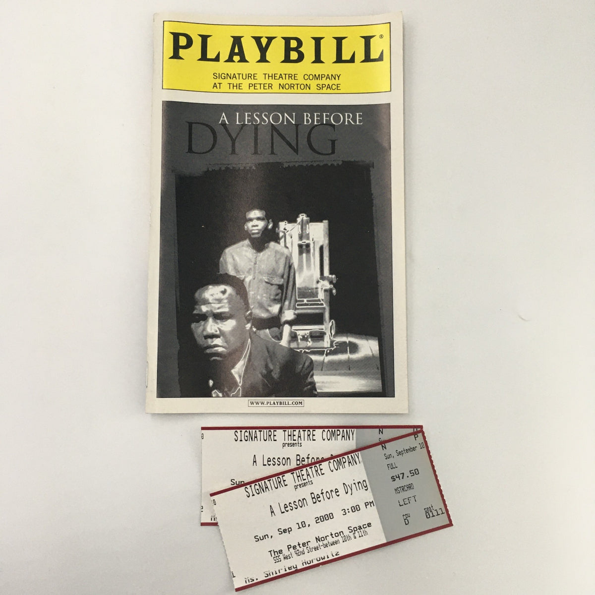 2000 Playbill for 'A Lesson Before Dying' by Signature Theatre Company featuring original tickets from the performance.