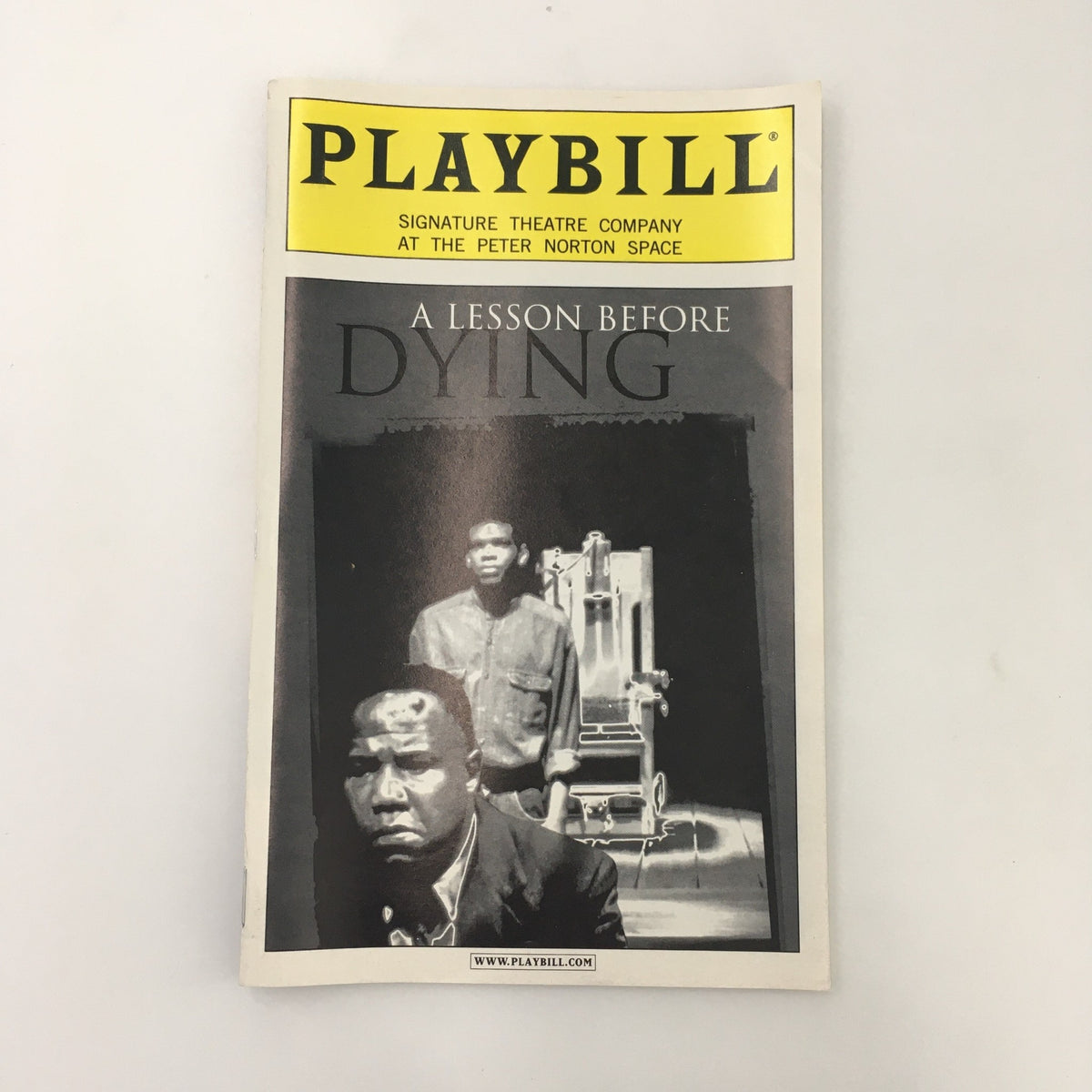 Close-up of the 2000 Playbill for 'A Lesson Before Dying' from Signature Theatre Company with a striking cover design.