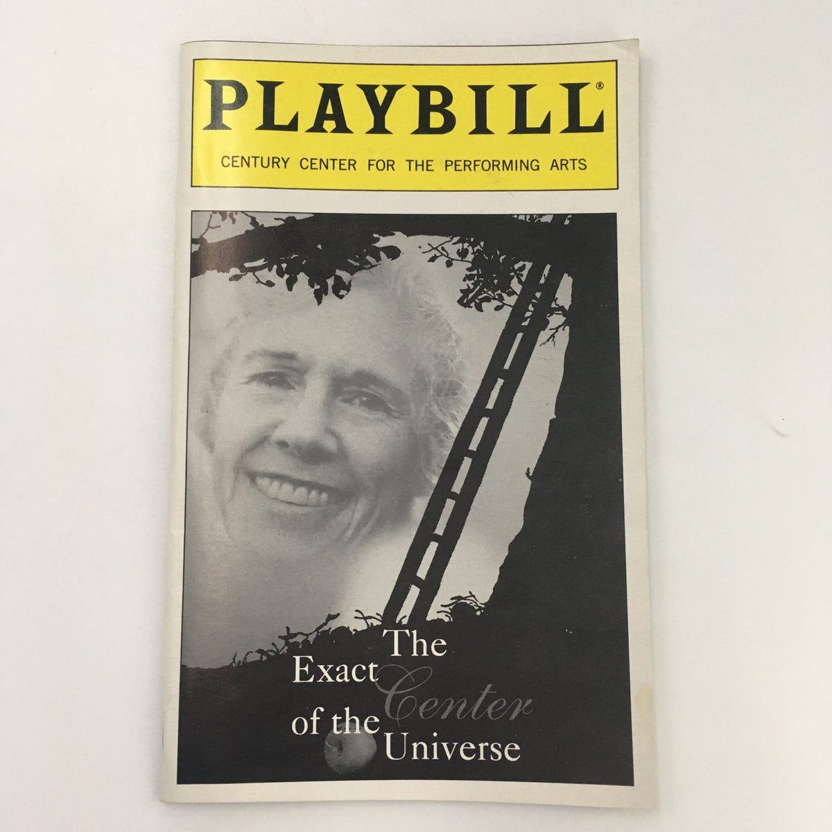 1999 Playbill for 'The Exact Center of the Universe' at the Century Center for the Performing Arts featuring a smiling woman on the cover.