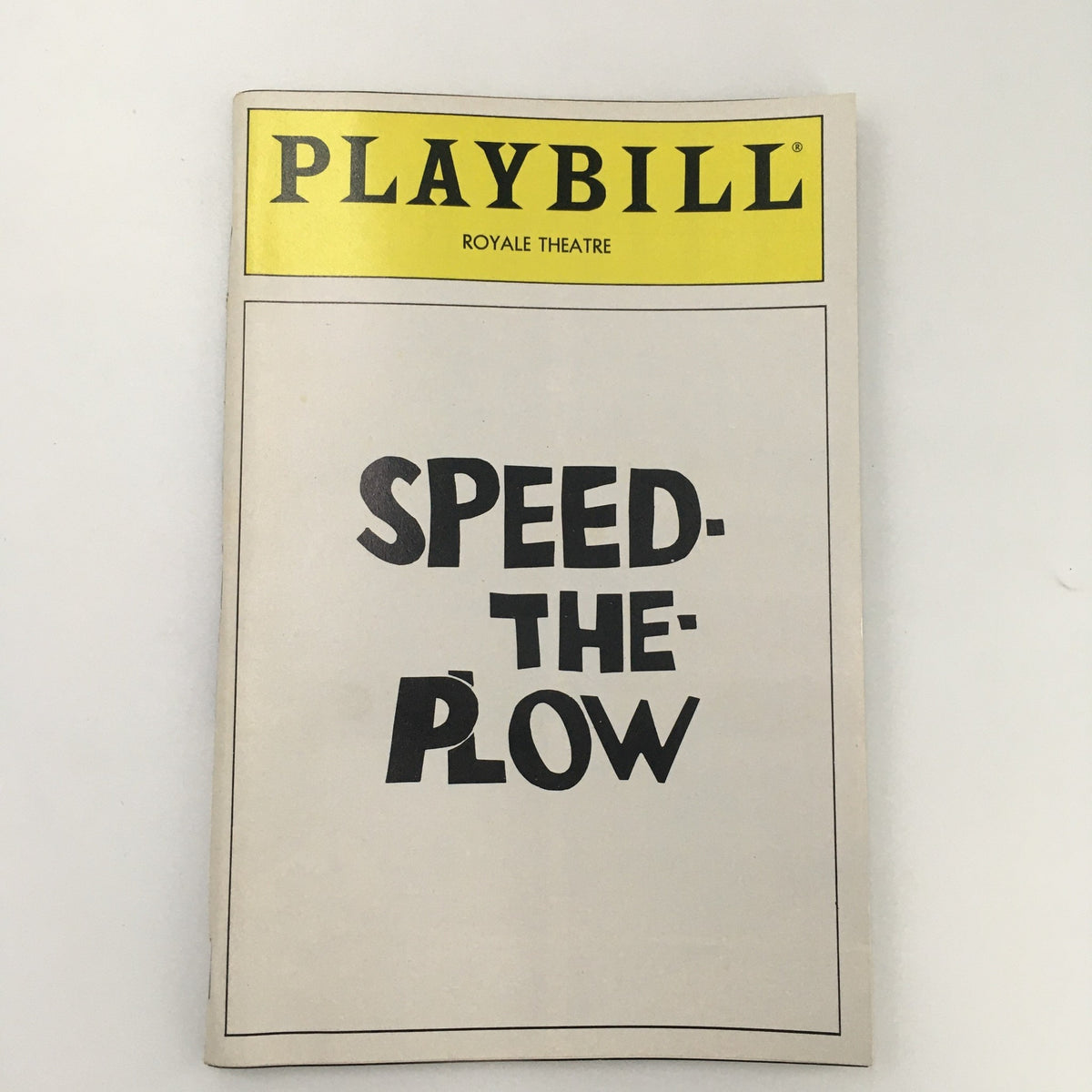 Cover of the 1988 Playbill for 'Speed The Plow' at Royale Theatre featuring bold text on a neutral background, highlighting the show's title.