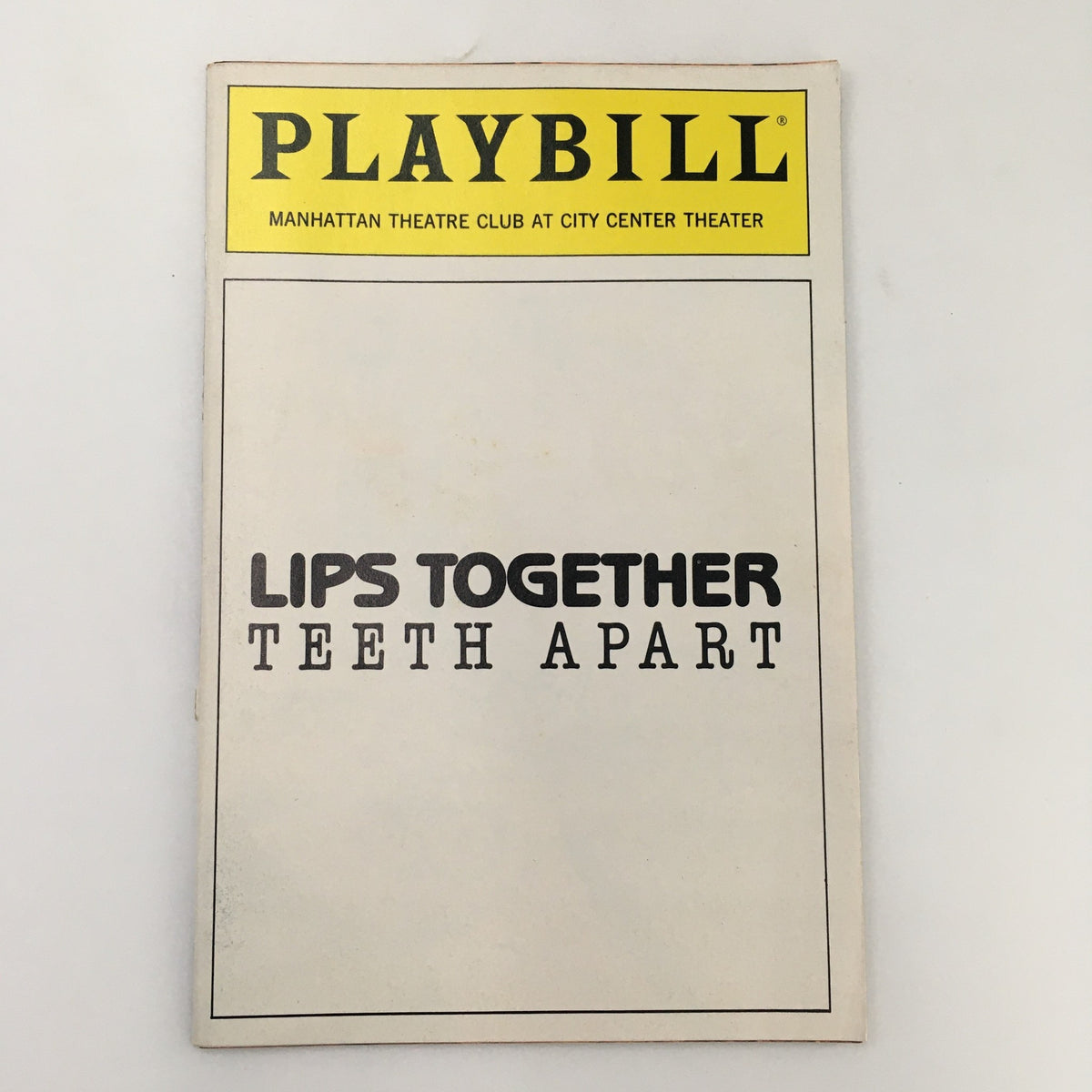 1991 Playbill cover for Manhattan Theatre Club's 'Lips Together Teeth Apart' featuring Nathan Lane. The cover showcases the title prominently in bold lettering.