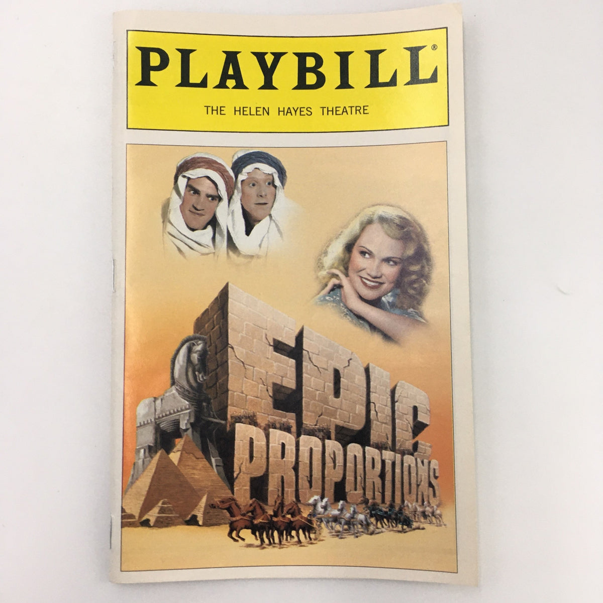 1999 Playbill The Helen Hayes Theatre 'Epic Proportions' featuring a colorful cover with images from the show including actors and a scenic backdrop.