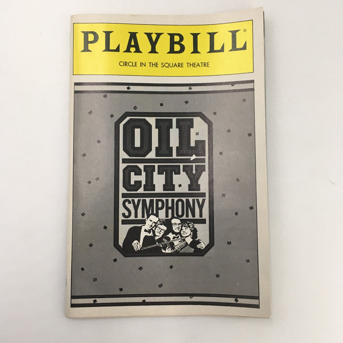 1988 Playbill for 'Oil City Symphony' at Circle in the Square Theatre featuring a vintage design and theatrical imagery.