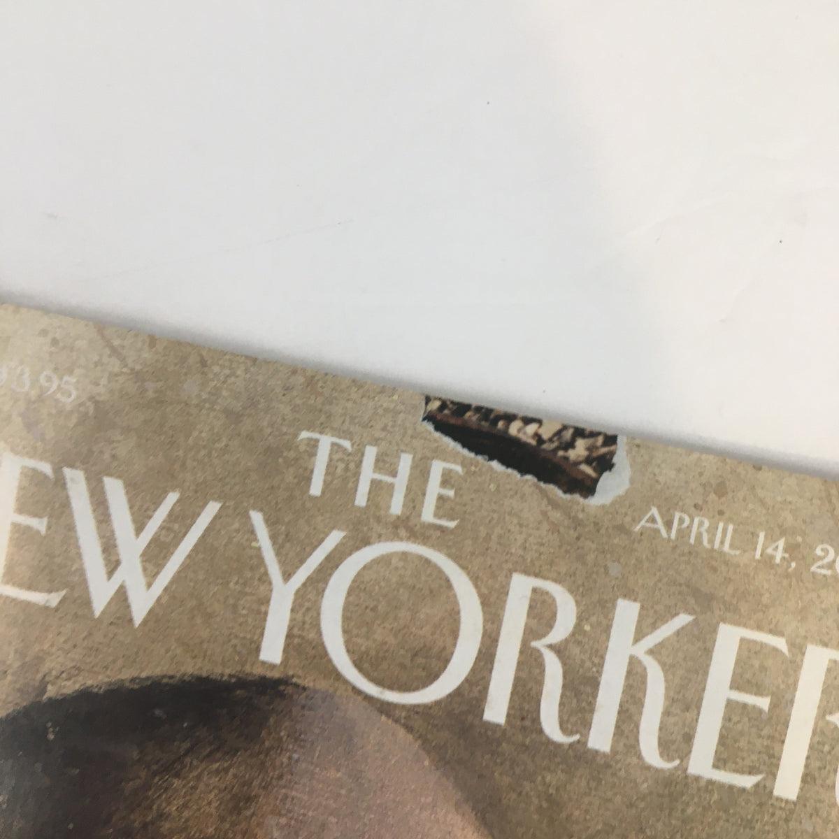 Detailed view of the cover of The New Yorker Full Magazine April 14 2003 Action by Ana Juan showing a small tear near the top.