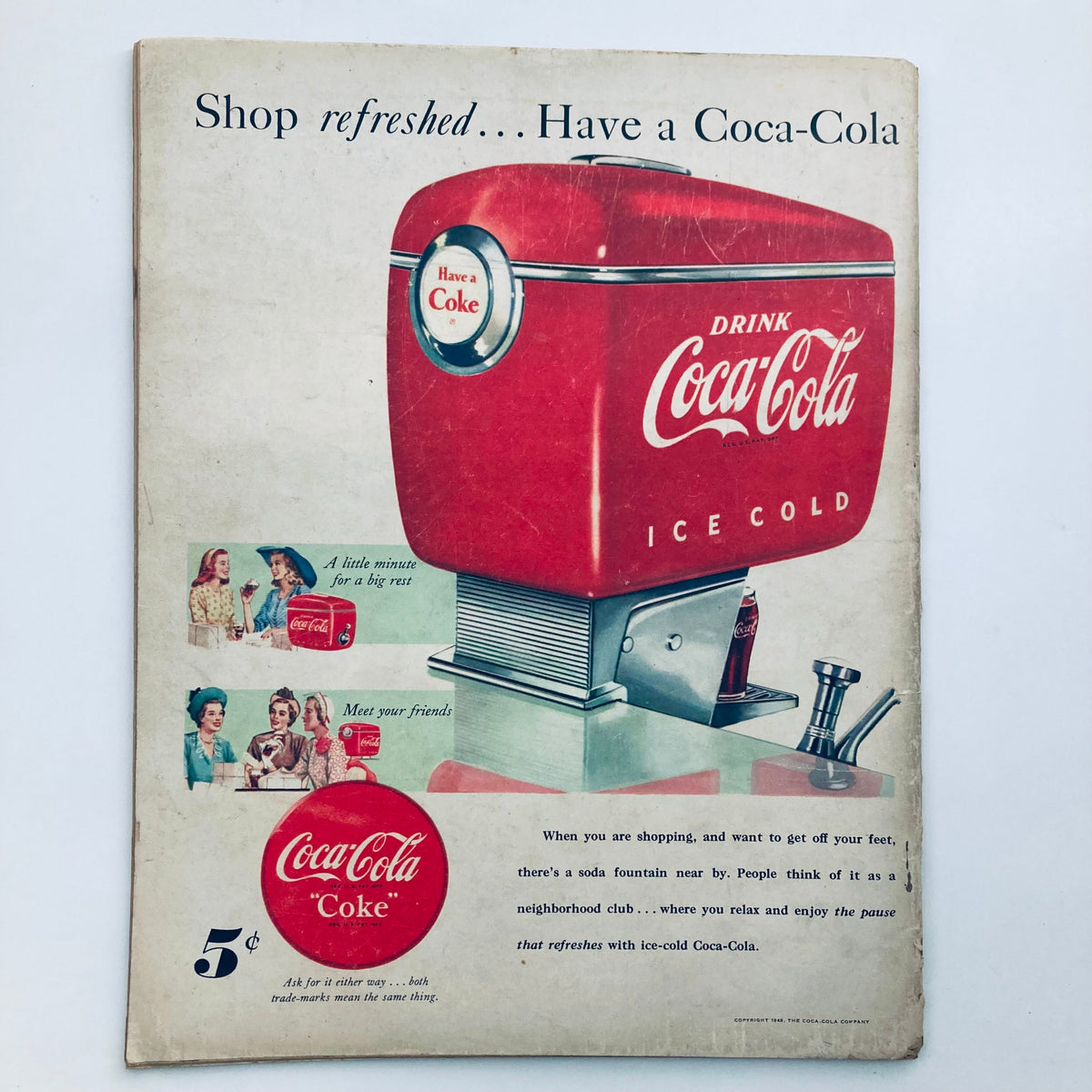Advertisement from the VTG Look Magazine June 22 1948 Vol 12 No. 13 showcasing a Coca-Cola ice cold drink dispenser with a promotional message encouraging shoppers to take a break.