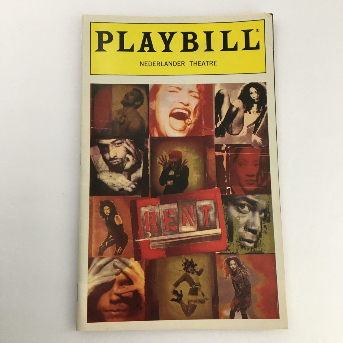 Close-up image of the 1998 Playbill Rent by Nederlander Theater, displaying the colorful cover with 'Rent' prominently featured, representing a significant Broadway production.