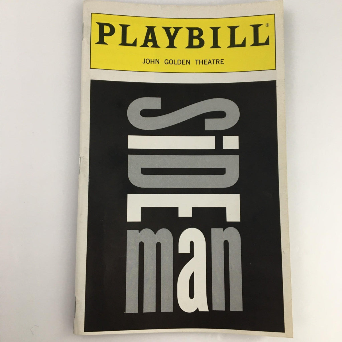 Cover of the 1999 Playbill for Side Man at John Golden Theatre, showcasing the iconic title design.
