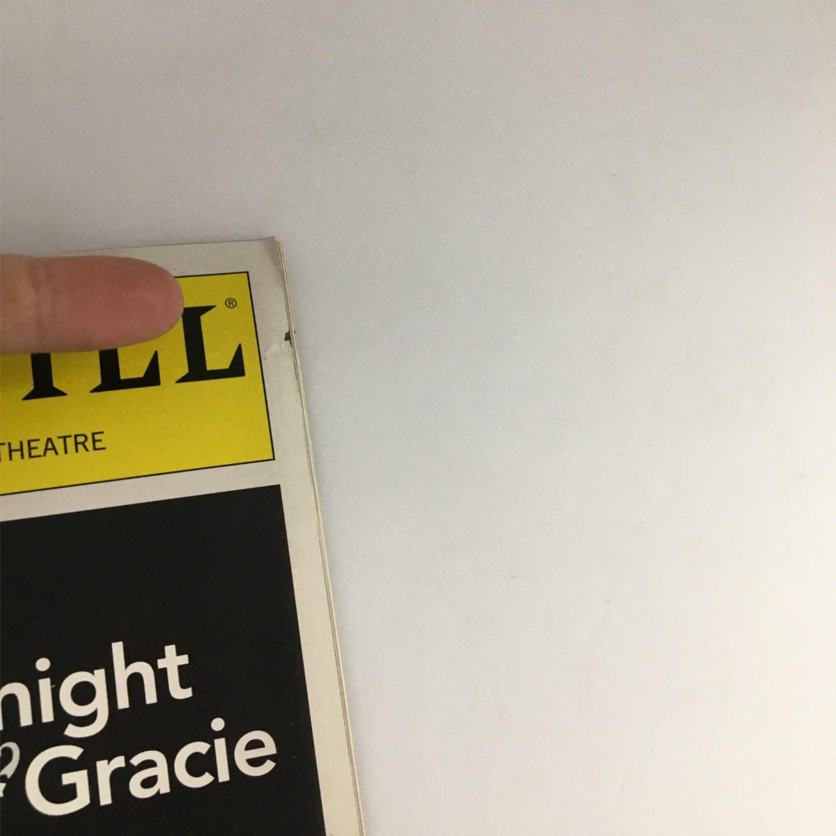 Close-up of the 2002 Playbill for 'Say Goodnight Gracie' at The Helen Hayes Theatre, showcasing the logo and the top corner of the cover.