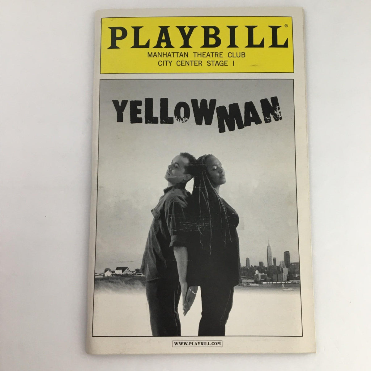 2002 Playbill for Yellowman featuring the poster design with two characters in silhouette against a city backdrop, presented by Manhattan Theater Club at City Center Stage I.