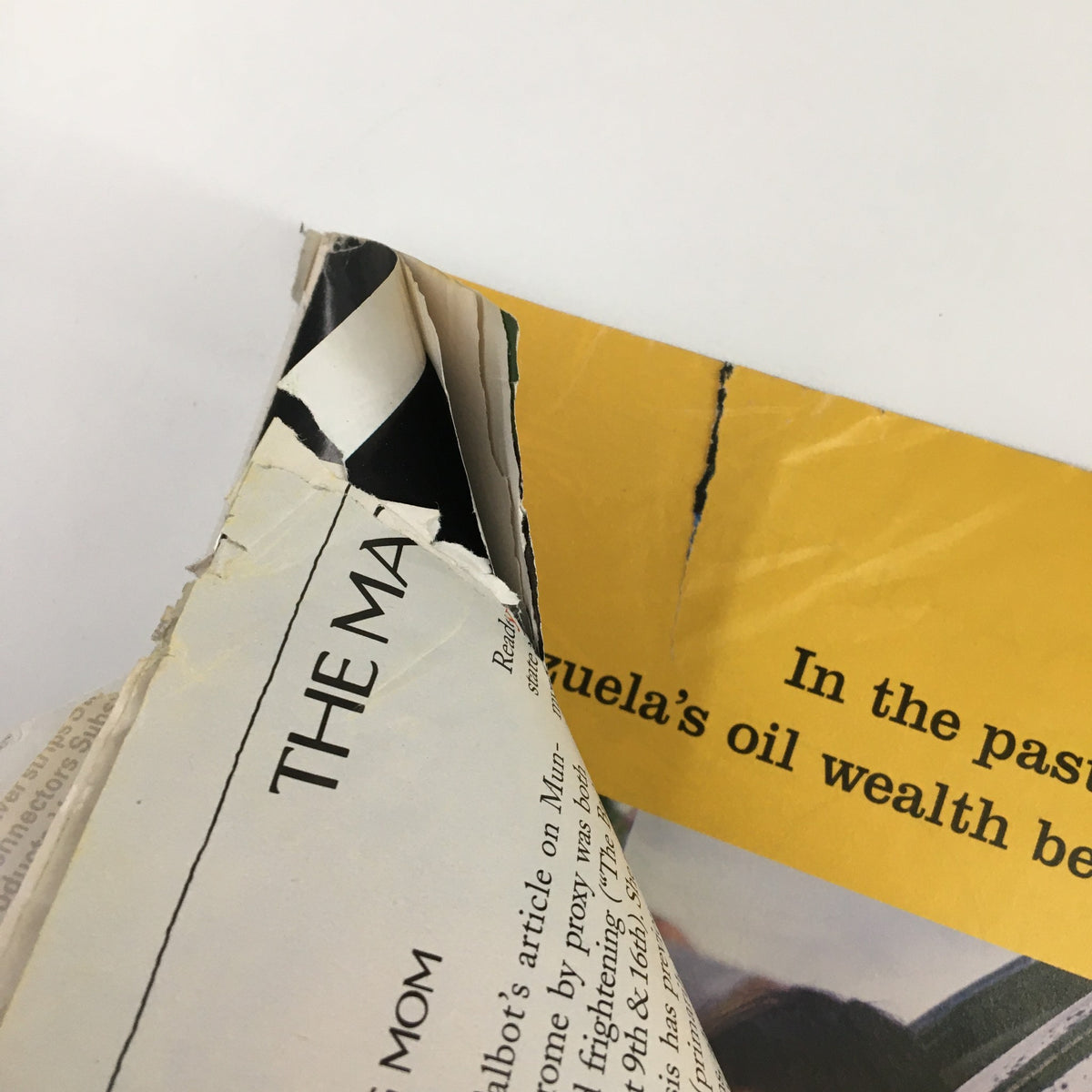 Torn edge of a page in The New Yorker Full Magazine September 13 2004 Deja Vu by Istvan Banyai, illustrating the magazine's used condition.