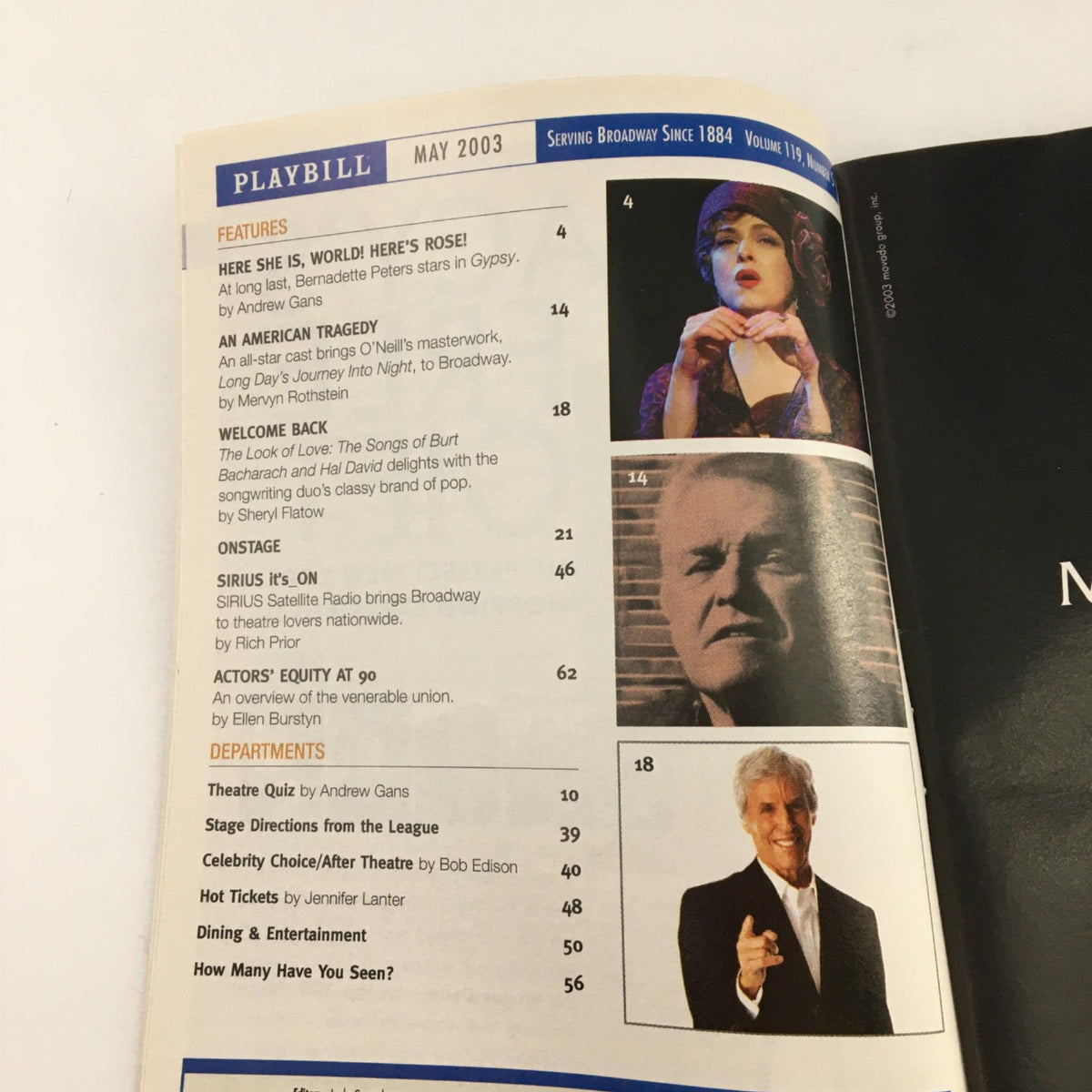 Inside view of the May 2003 Playbill featuring various theater features and highlights.