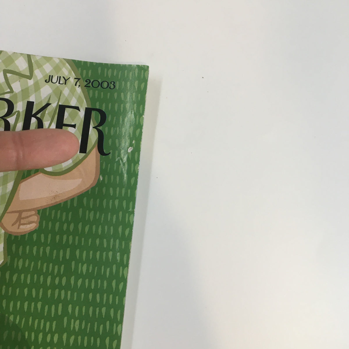 Close-up view of The New Yorker Full Magazine, July 7, 2003, showcasing the title and part of the cover illustration, highlighting its artistic details.