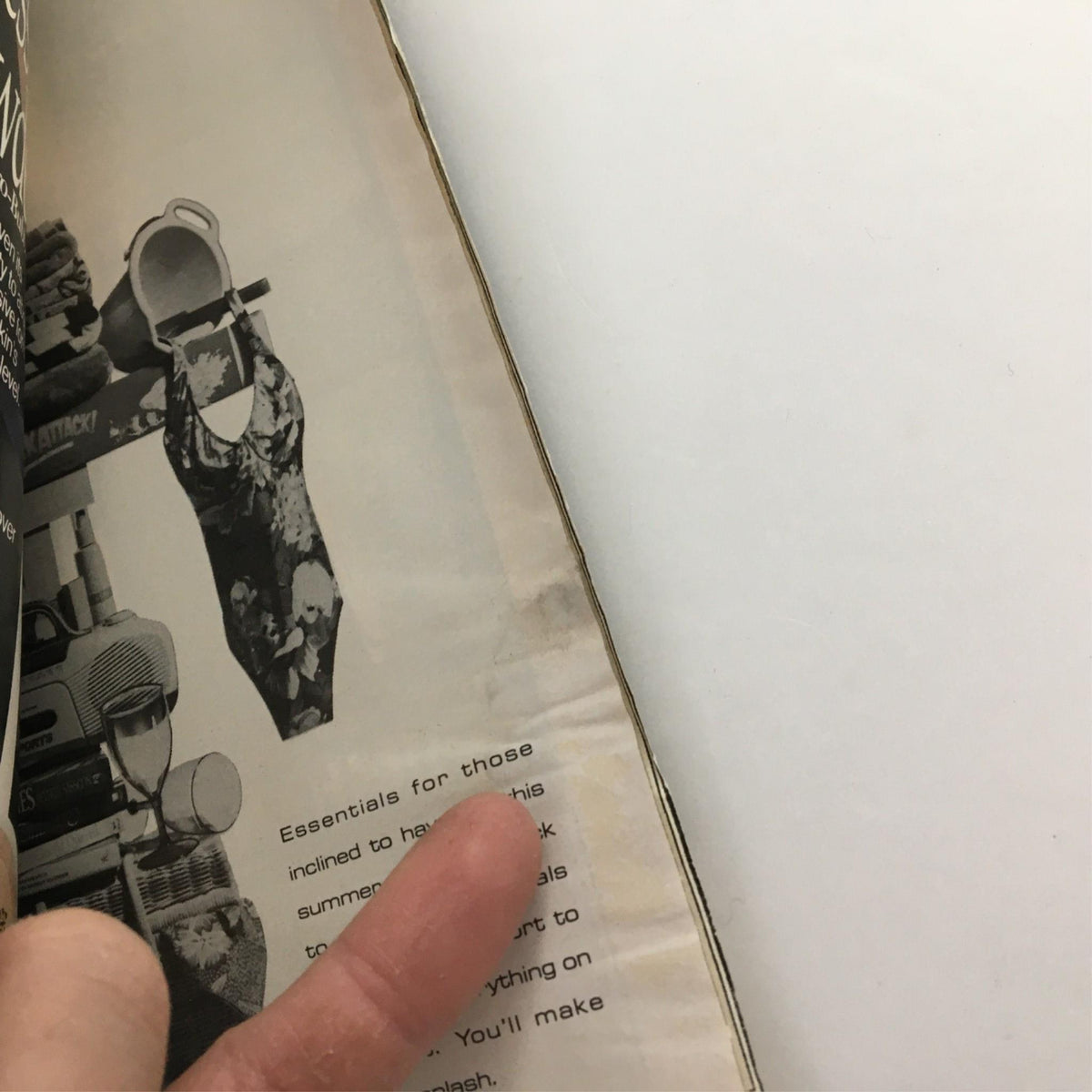 Detailed shot of the interior pages of the 1990 Playbill for 'Each Day Dies with Sleep' displaying advertisements and fading features, a testament to its authenticity.