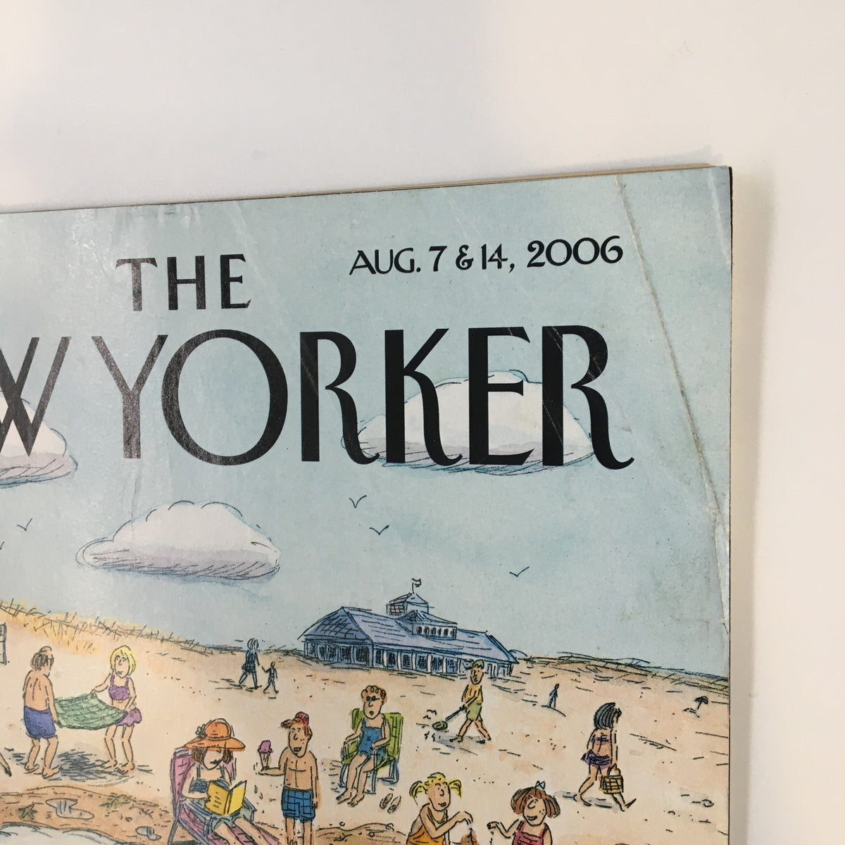 Close-up of the top section of The New Yorker Full Magazine August 7 2006, showcasing the magazine title and date against a serene beach background.