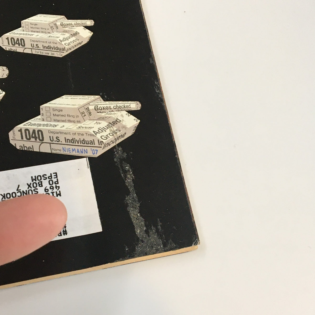 Detail view of the back cover of The New Yorker magazine, featuring address label and wear, from the April 9, 2007 issue titled 'T-Day' by Christoph Niemann.