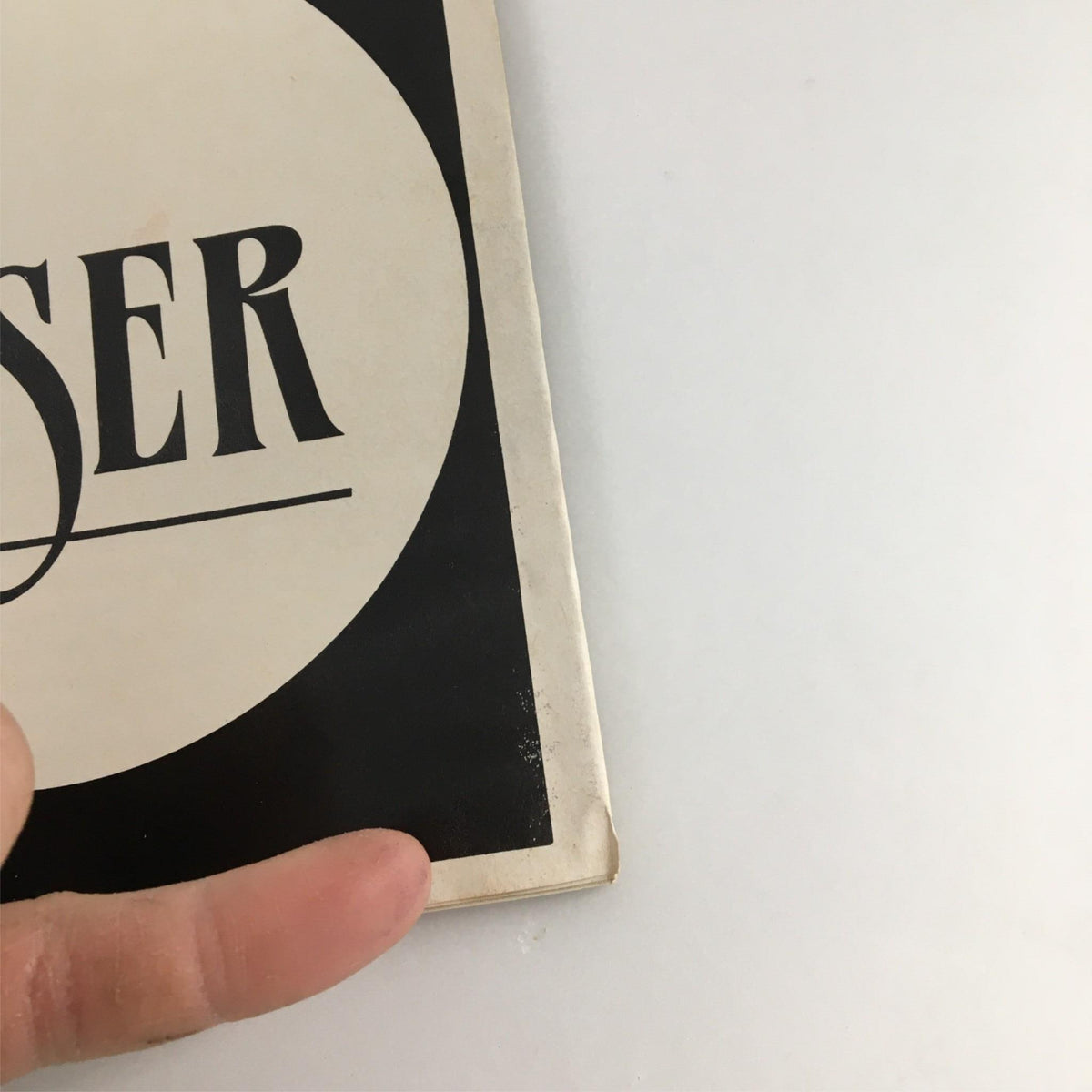 Close-up view of the corner of the 1990 Playbill for The Miser by Circle in the Square Theater showing minor wear.