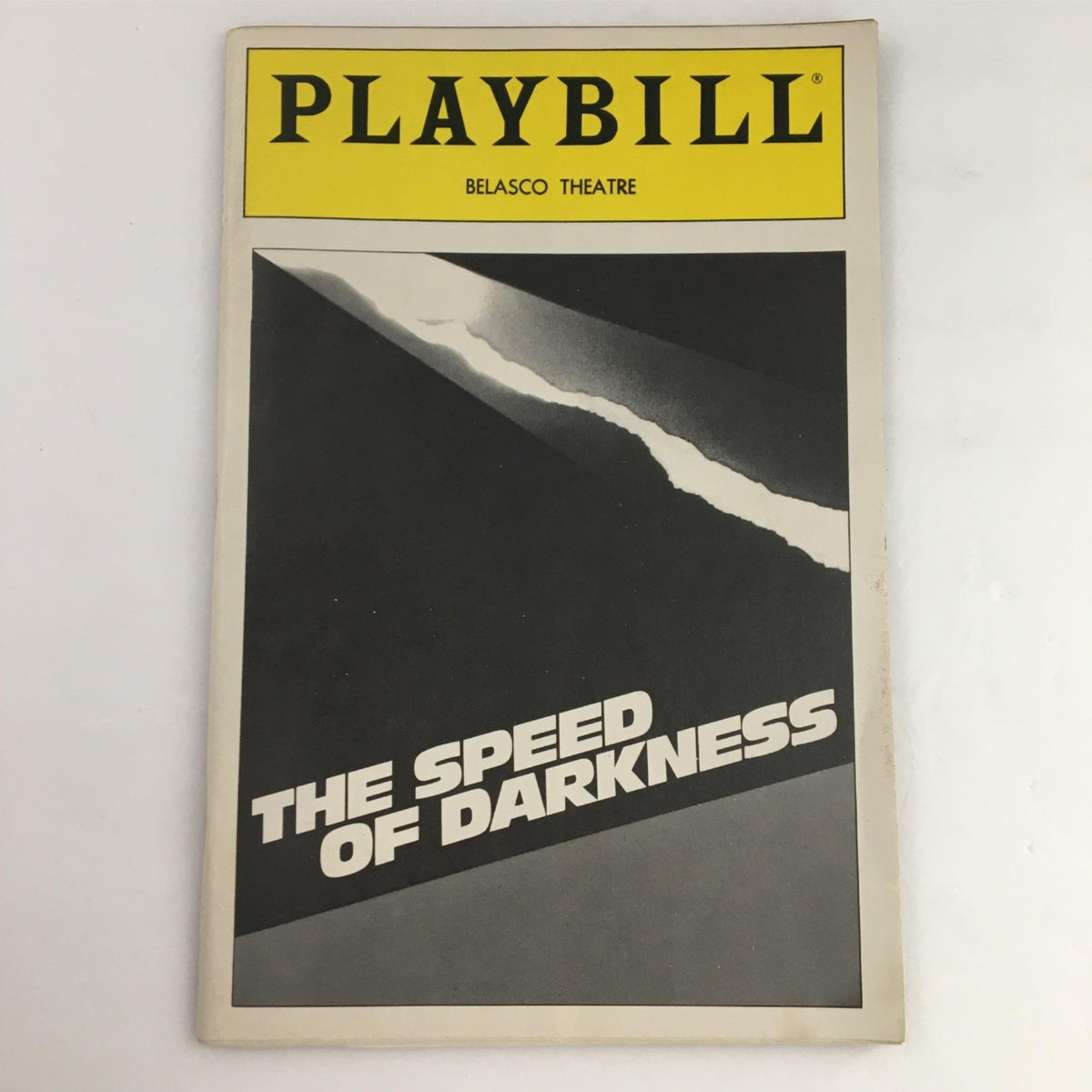 1991 Playbill for The Speed of Darkness at Belasco Theatre, showcasing a striking black and white cover design.