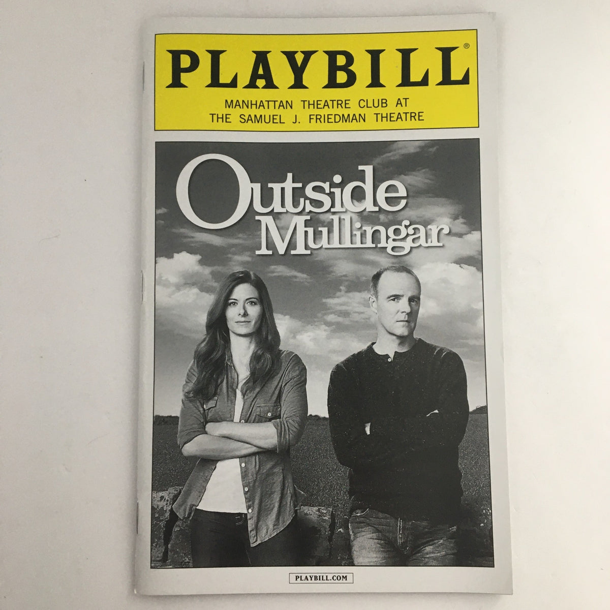 2014 Playbill for the Manhattan Theatre Club production of 'Outside Mullingar' featuring the cover image with the title and actors' portraits.
