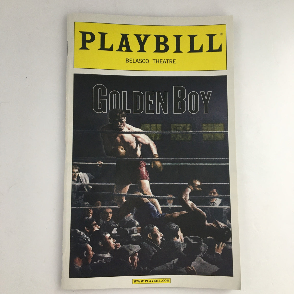 2012 Playbill for Lincoln Center Theater 'Golden Boy', featuring a striking cover image of a boxing match, highlighting the theatrical performance that captivated audiences.