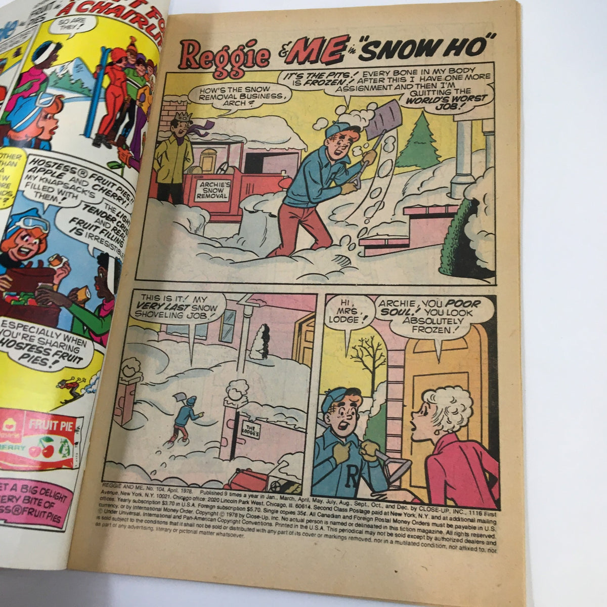 Inside page of Archie Series April 1975 Reggie and Me No. 104 comic showing a humorous snow shoveling scene with Reggie and Archie.