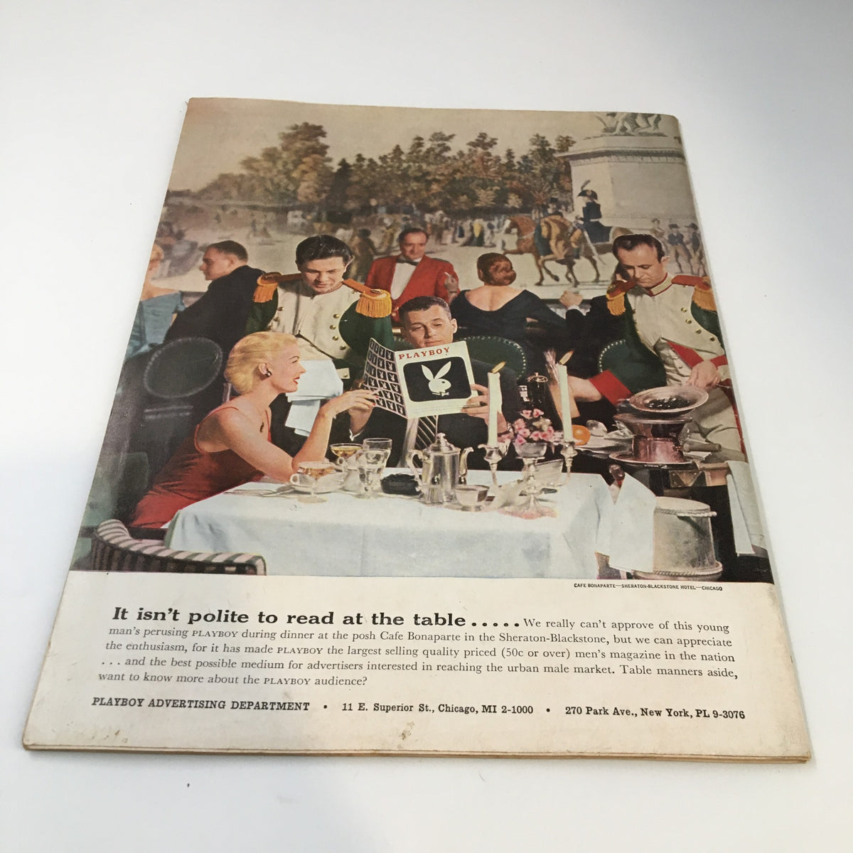 Advertisement page from VTG Playboy Magazine September 1956 depicting a dining scene with men and women.