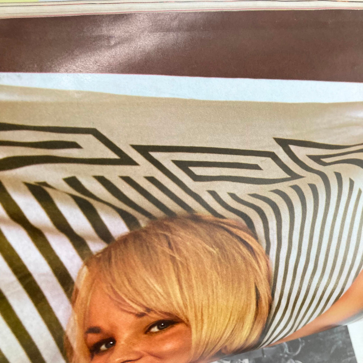 Close-up of VTG Playboy Magazine October 1966 featuring Playmate Linda Moon, showcasing vintage pin-up culture.