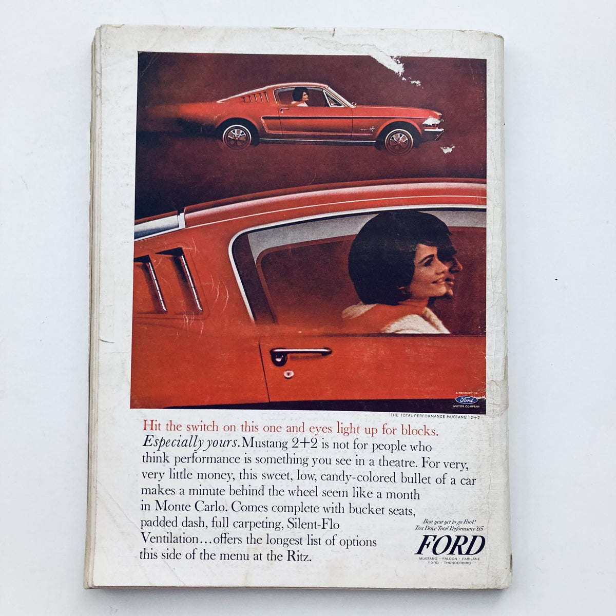 Back cover of VTG Playboy Magazine December 1964 featuring a Ford Mustang 2+2 advertisement with a woman inside the car.