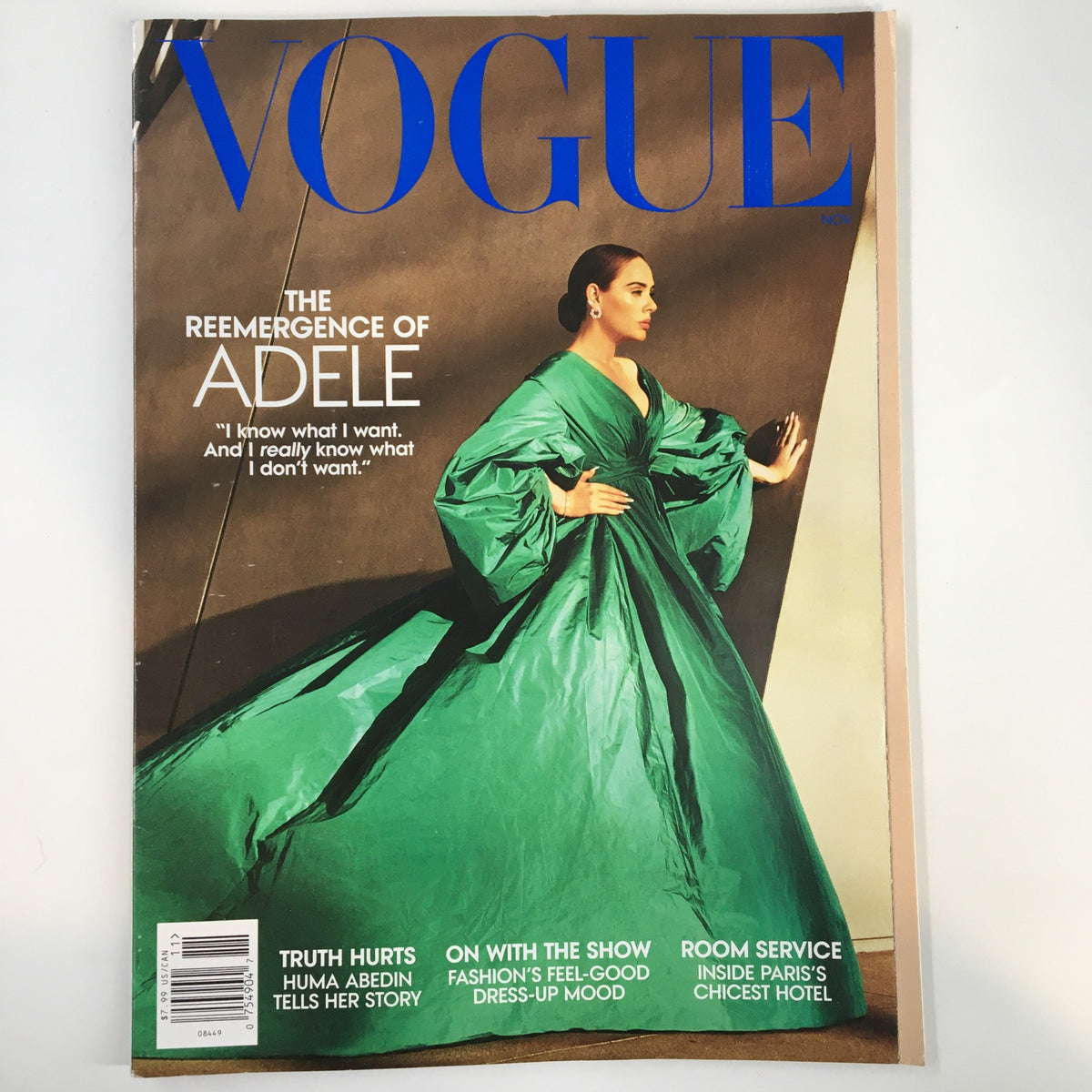 Vogue Magazine November 2021 cover featuring Adele in a striking green dress, symbolizing her reemergence and personal journey.