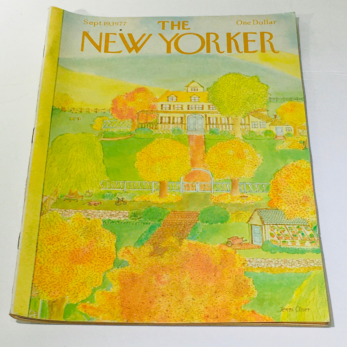 Cover of The New Yorker magazine from September 19, 1977, featuring a vibrant illustration by Jenni Oliver depicting a scenic landscape with colorful autumn trees and a charming house.