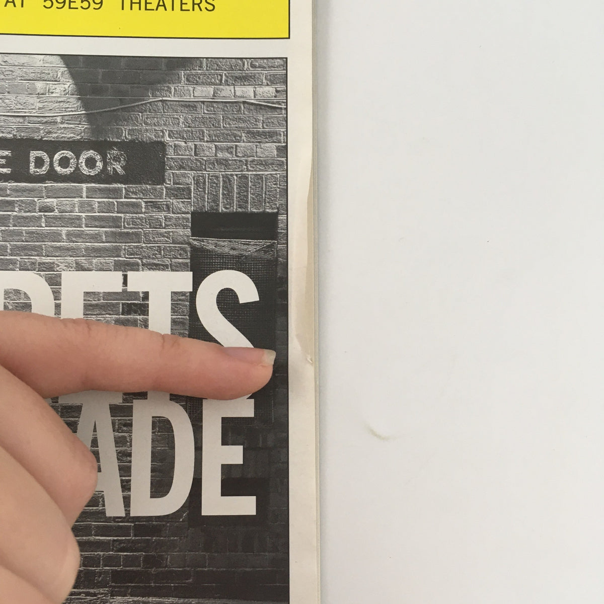 Close-up image of the 2010 Playbill Primary Stages Secrets of the Trade showing minor wear and a small crease on the cover.