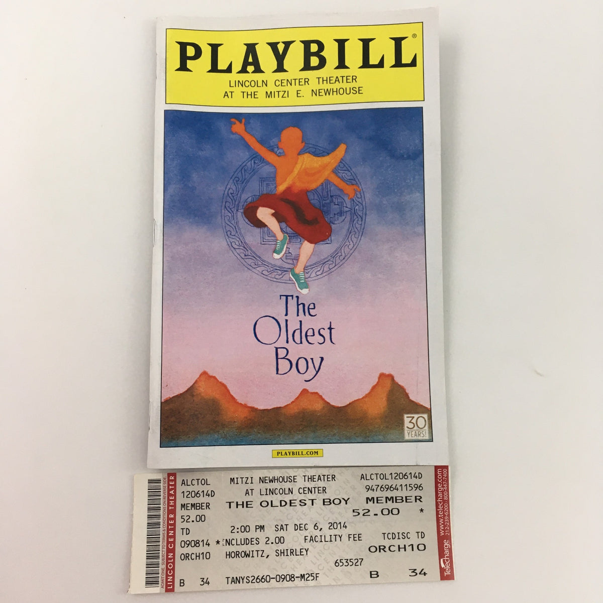 2014 Playbill for 'The Oldest Boy' by Sarah Ruhl, accompanied by the original ticket from the performance at the Mitzi E. Newhouse Theater.