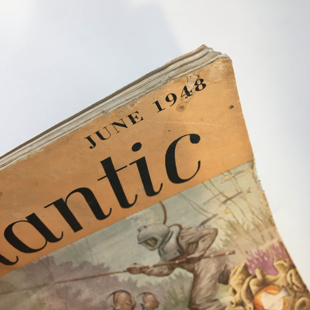 Top view of the VTG The Atlantic Magazine June 1948, emphasizing the date and the magazine's historical significance with visible wear and tear.