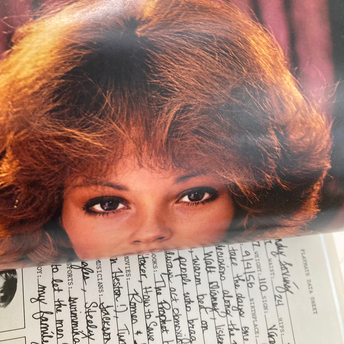 Inside page of the VTG Playboy Magazine January 1979 displaying the Playmate of the Month, Candy Loving, with a focus on her captivating gaze and vintage aesthetic.