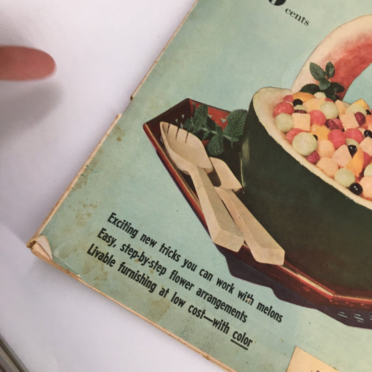Detail of the VTG Household Magazine August 1952 cover emphasizing creative food presentation with fruits and decorative elements.