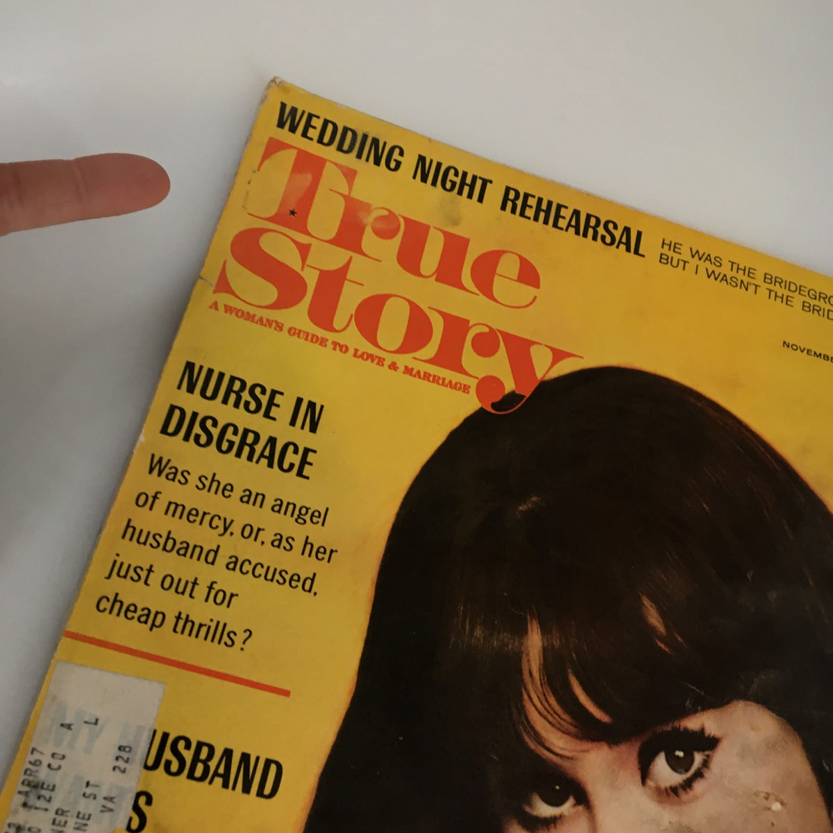 Close-up view of the cover of VTG True Story Magazine November 1966 emphasizing the title with headlines like 'Nurse in Disgrace' and 'Wedding Night Rehearsal', showcasing vintage design elements.