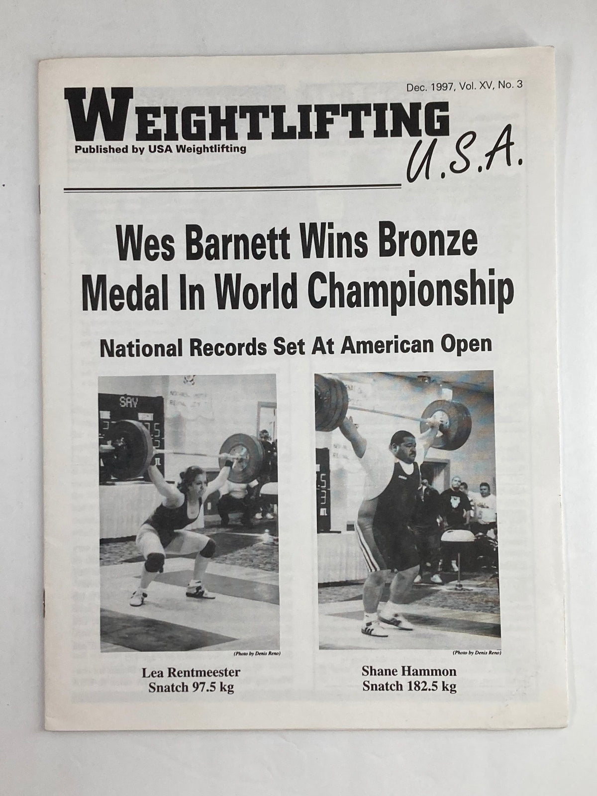 Cover of Weightlifting USA Magazine Vol 15 #3 from December 1997 featuring the title 'Wes Barnett Wins Bronze Medal In World Championship' and photos of Lea Rentmeister and Shane Hammon during lifting events.