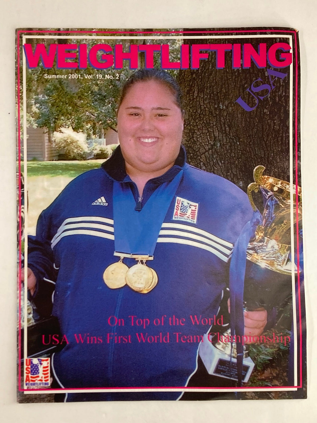 Cover of Weightlifting USA Magazine Vol 19 #2 Summer 2001 featuring Cheryl Haworth with medals, celebrating the USA's first World Team Championship.