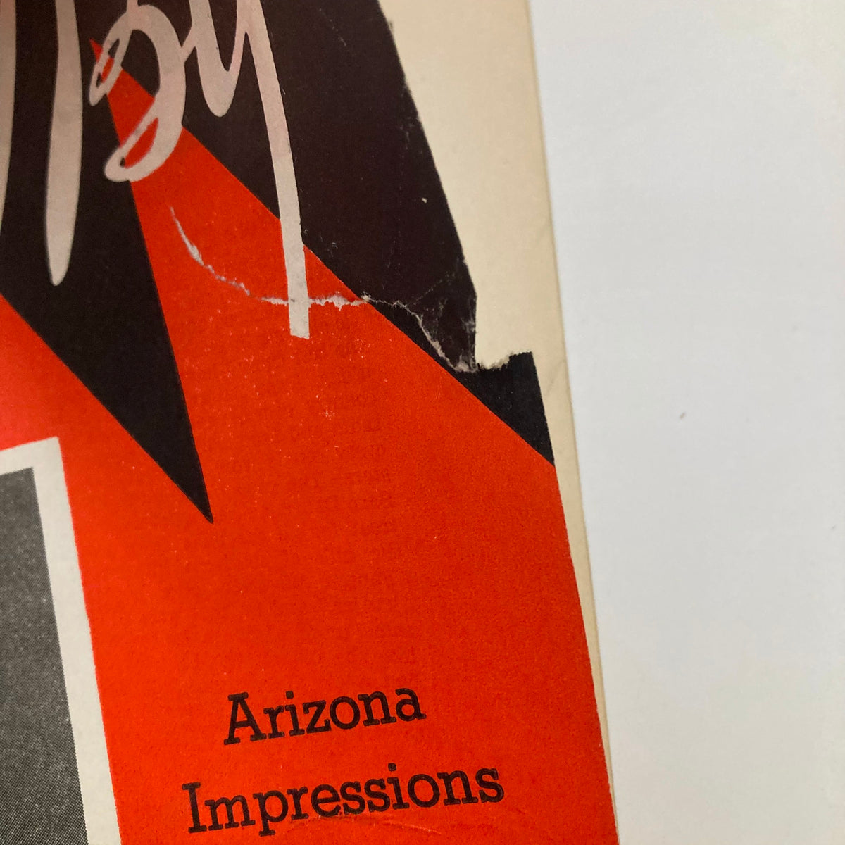Close-up detail of the cover of VTG Stand By Magazine from February 19, 1938, showcasing the title 'Arizona Impressions' with vibrant red and black colors.