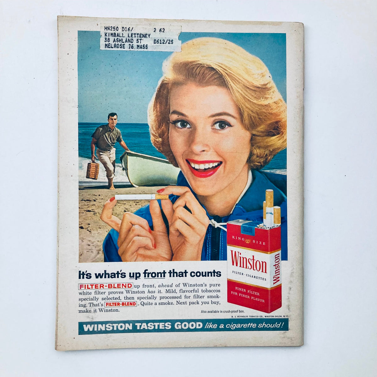 Vintage advertisement featuring a woman promoting Winston cigarettes, showcasing the brand's filter blend. Part of the VTG Hot Rod Magazine October 1961 Vol 14 No. 10 Dodge's New Hi-Power Option issue.